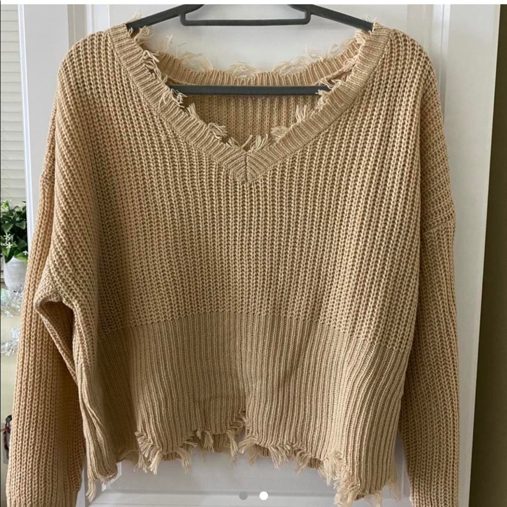 Distressed knitted sweater